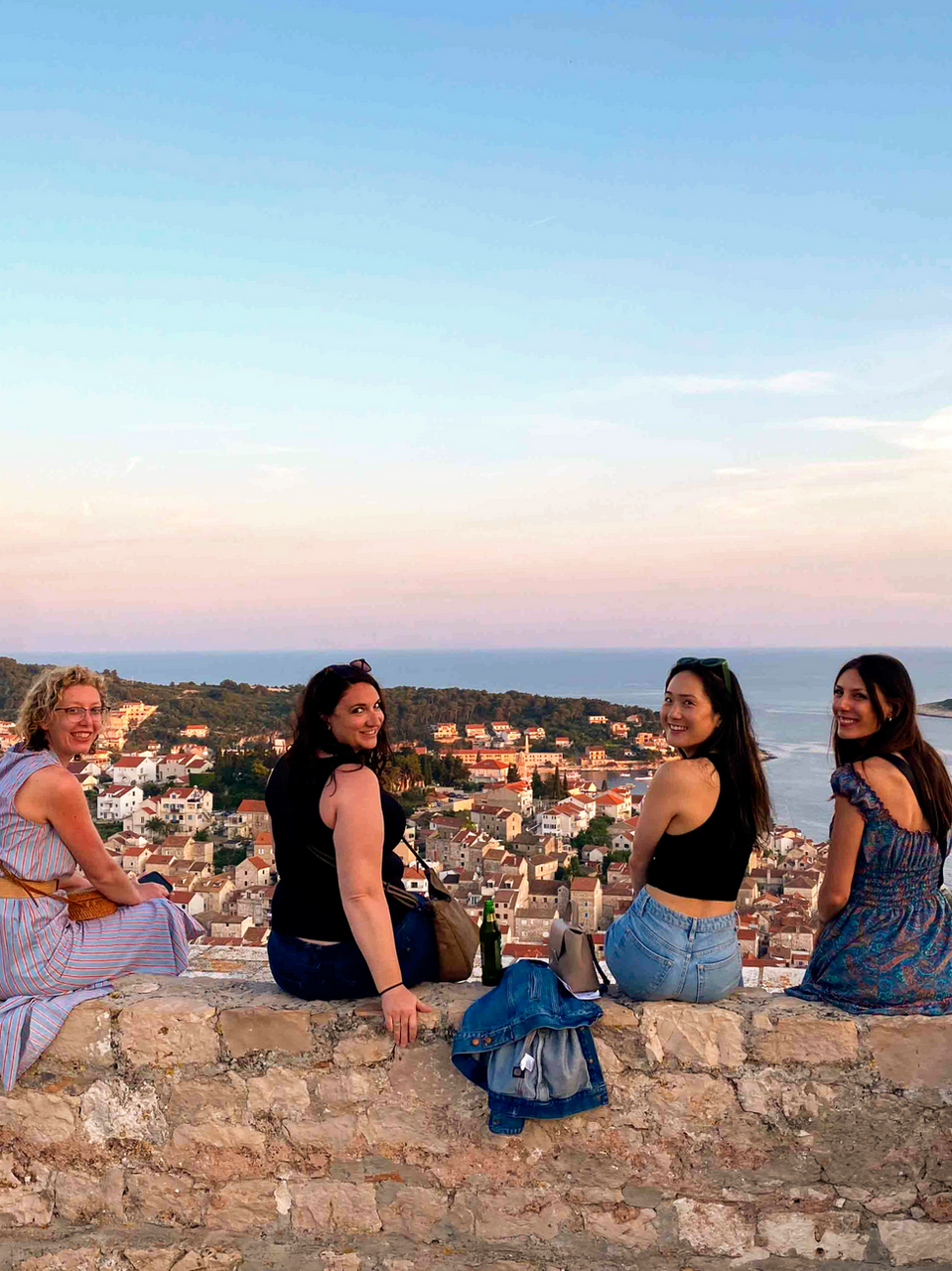 FTLO travelers sitting on Dubrovnik’s city walls