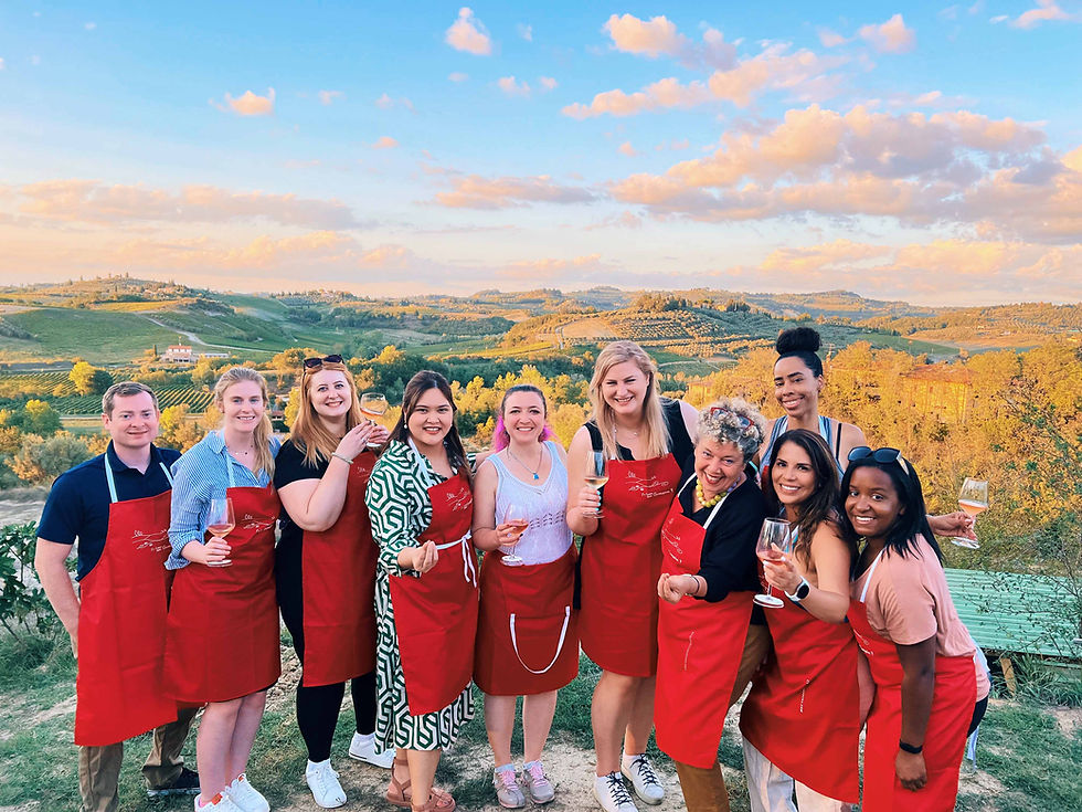 Group of solo travelers enjoying wine in tuscany with FTLO Travel 