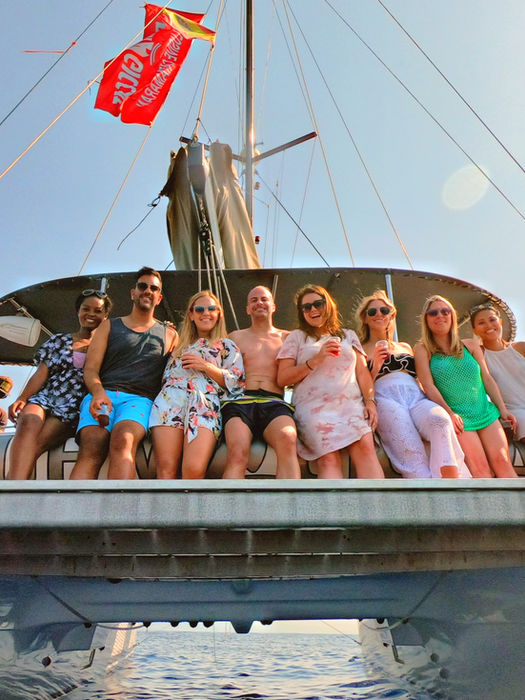 Group of young professionals on a catamaran during the FTLO Barcelona and South of France trip