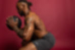 Man wearing LIFTR performance gym shorts in a crouched training pose