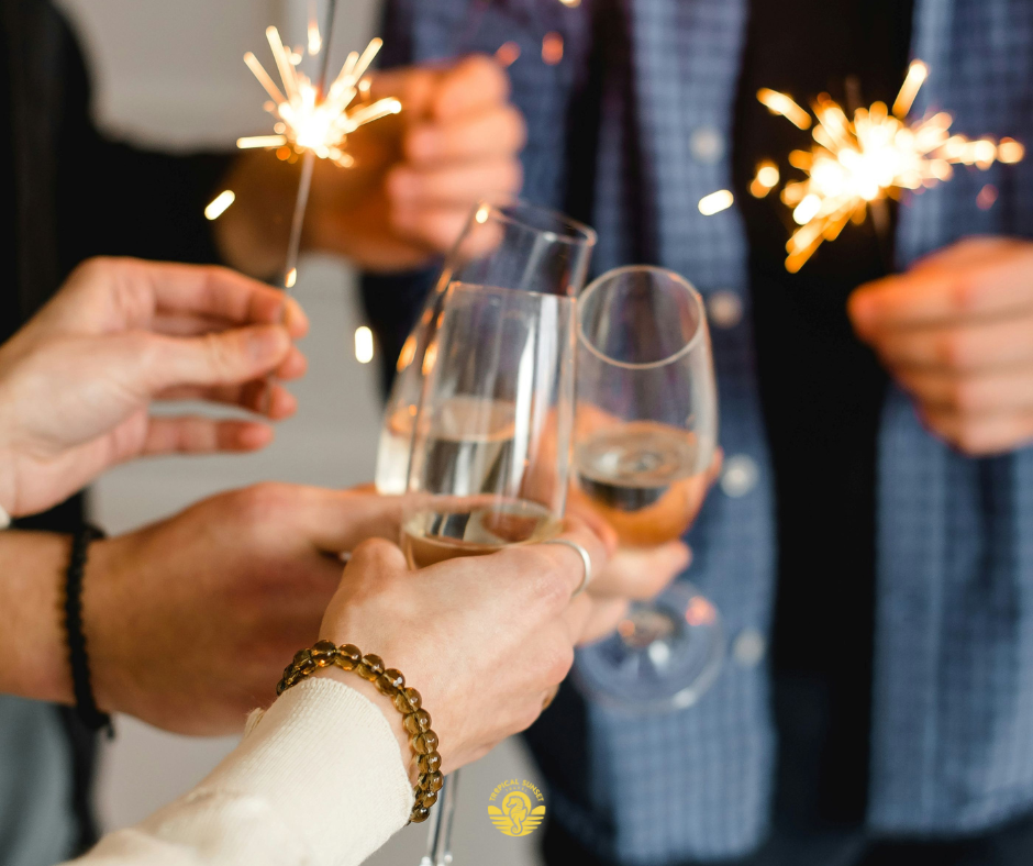 Cheers (people cheers-ing with champagne and sparklers) Reference: Photo by Kateryna Hliznitsova on Unsplash