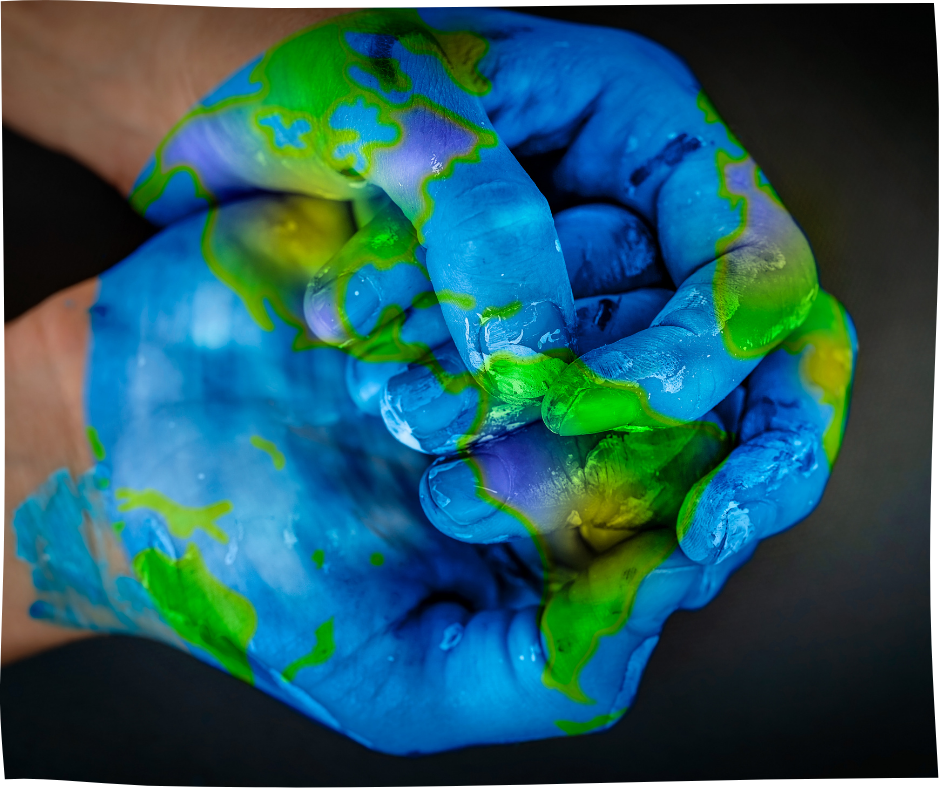 a pair of hands covered in blue and green paint to represent earth