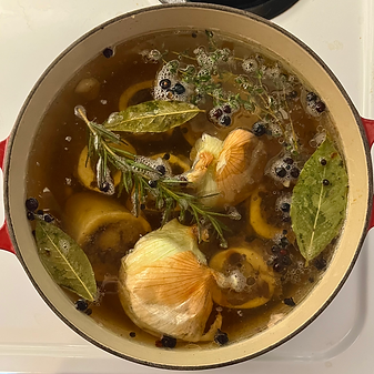 bones and vegetables simmering in broth