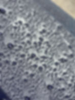 Water beads on car's ceramic coating after detailing