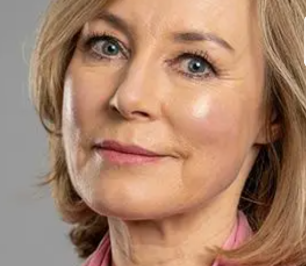 Sian Williams with short blonde hair and pink shirt smiles softly, set against a gray background. "The Psychologist" text appears at the top.
