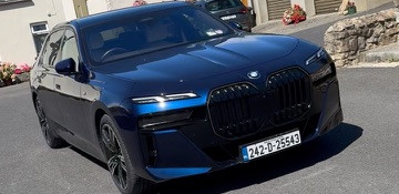 Black car parked outdoors for multi-stage correction.