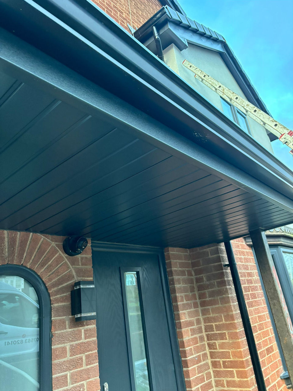 Dark gray seamless gutters and soffit