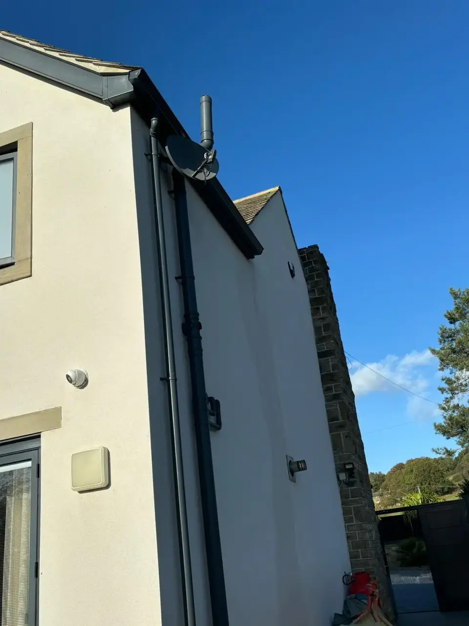 Dark gray seamless gutters on house