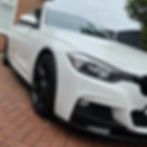 Clean white BMW 3 Series parked outside