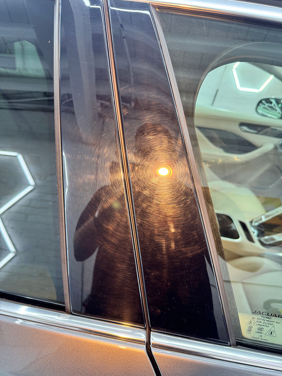 Reflected light on car door during deep clean inspection