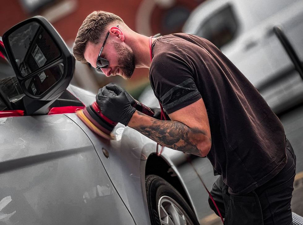 Man polishing silver car with Elite Touch