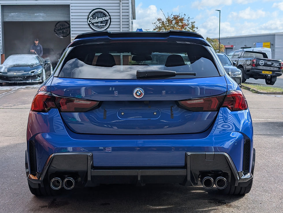 Blue BMW car rear view with exhaust pipes, Dave Detailing service.