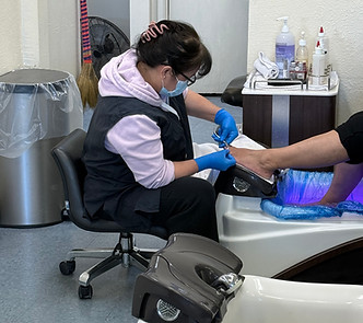 Pedicure being applied while customer relaxes