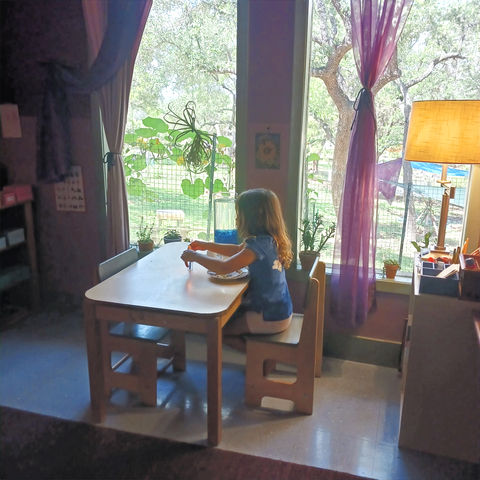 a child playing at a table