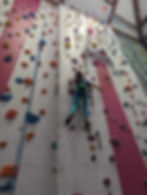 Girl climbing with top ropes at Ingleton Wall