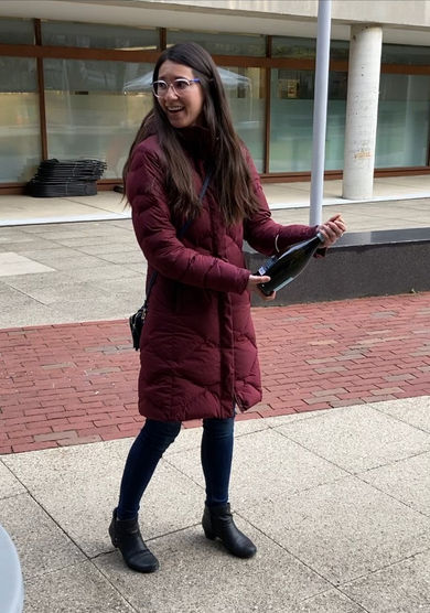 Woman popping champagne