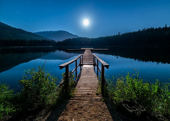 dock on lake at nighttime