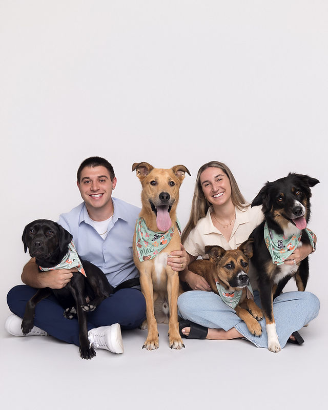 couple with three dogs