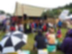 Braintastic's Ginny performs a fun science show at a science week festival - she stands in front of a dozen kids taking part in a demo on stage, while families watch on 