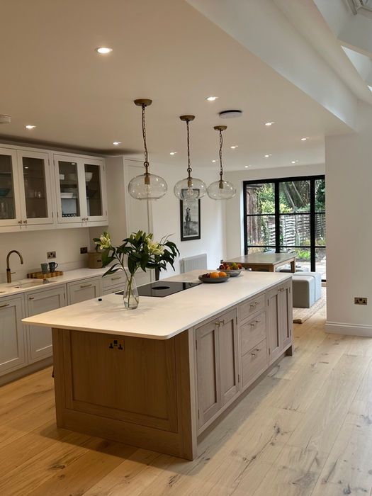 Modern kitchen extension in West Hampstead with skylights and garden doors.