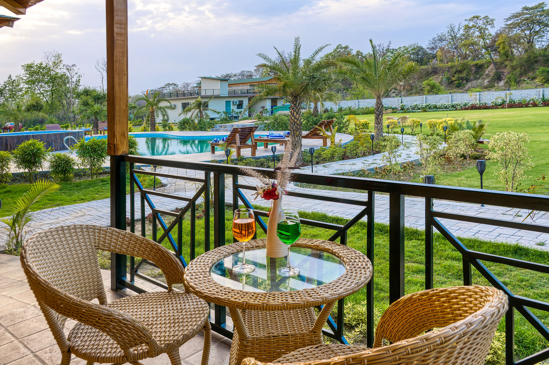 Swimming pool at a luxury jungle resort in Jim Corbett offering comfort and relaxation.