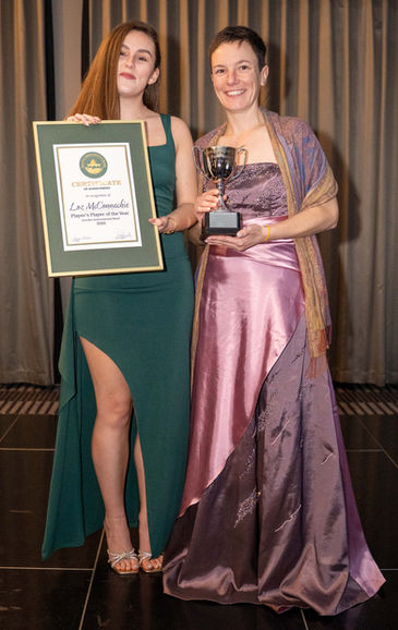 Loz McConnachie receives her trophy and certificate from DIB Committee member Jasmine Selbie for winning the Player's Player of the Year.