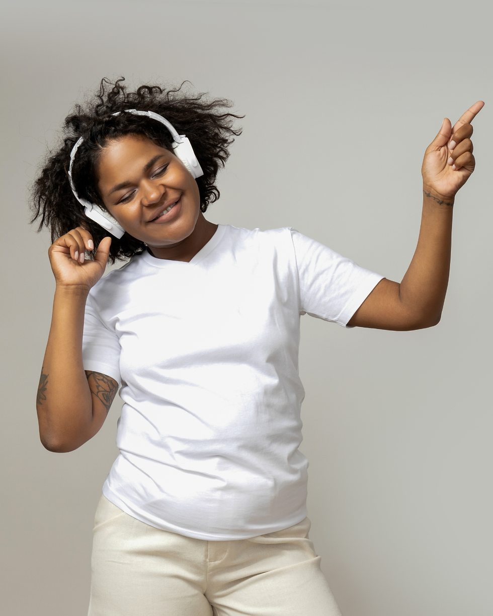 Image representing a young lady dancing to the beat on the radio