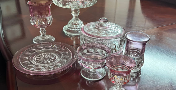 Red and clear glassware on a table.