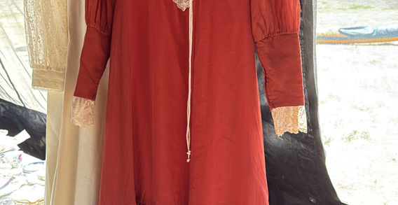 Red long sleeved dress with lace details.