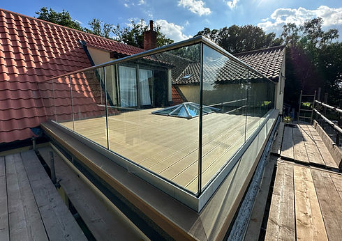 Composite decking and frameless glass balustrade on a rooftop