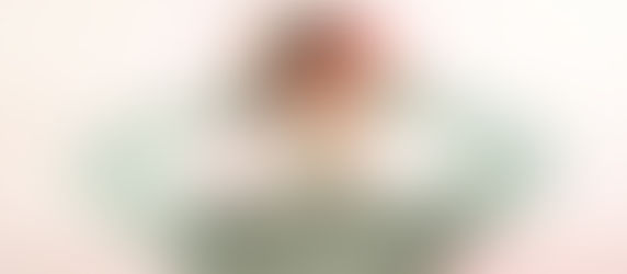 a lady holding her head confused