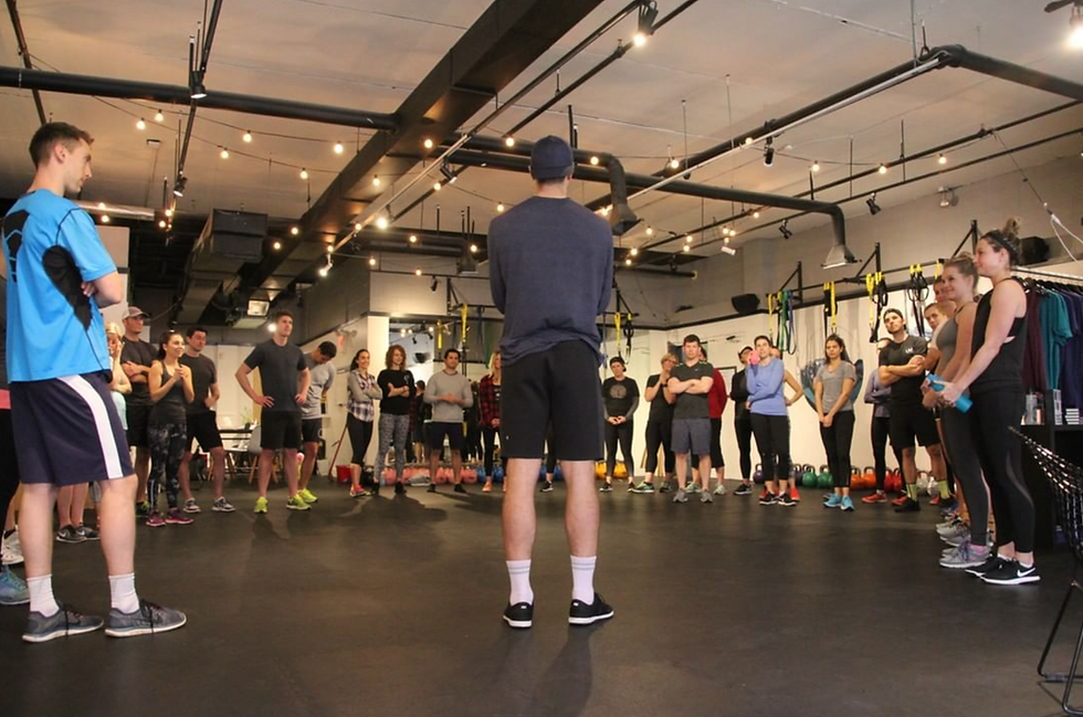 personal trainer and clients in studio
