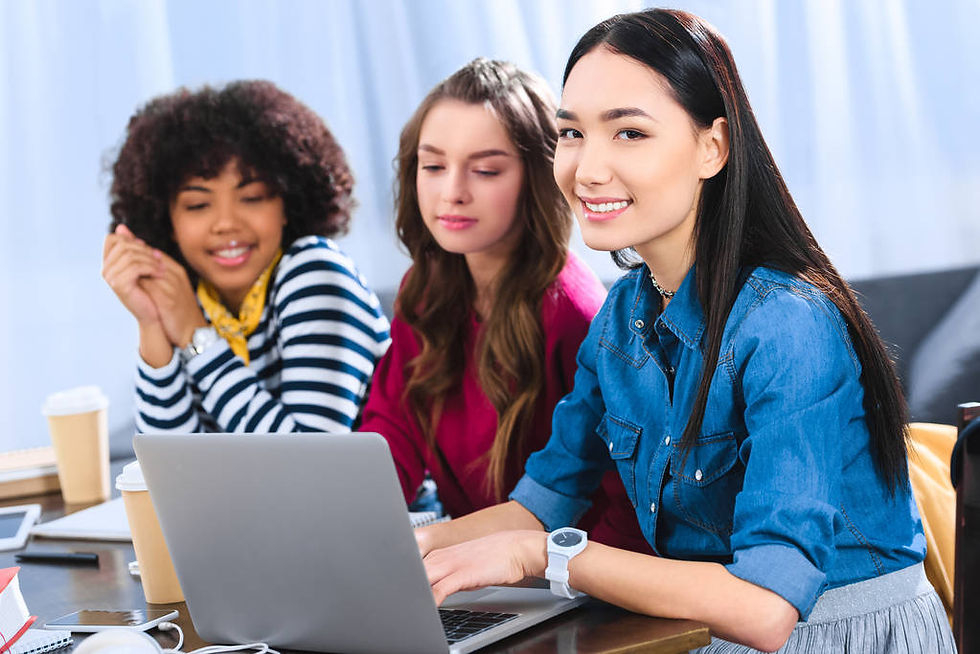 A group of women speaking different languages while browsing a website.