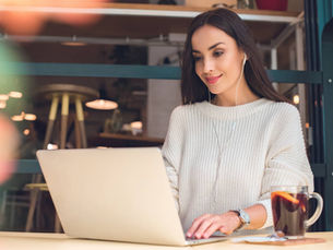 A woman adding essential Wix apps to her Wix site