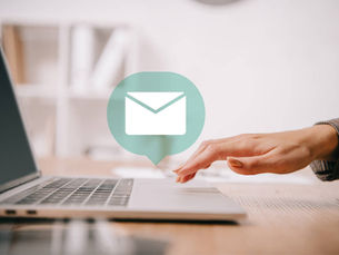 A woman setting up an automated email through Wix’s CRM & automation tools.