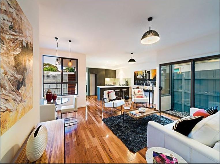An open-plan room complete with kitchen and lounging area—a perfect house extension idea