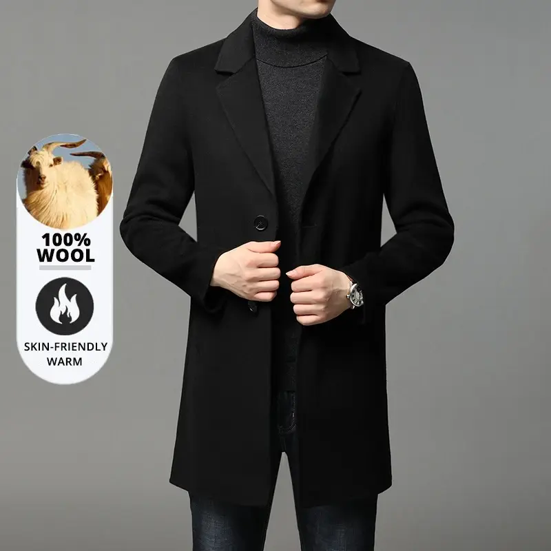 Man in a black wool coat over a dark turtleneck and jeans, with 100% wool and skin-friendly warm labels on the side.