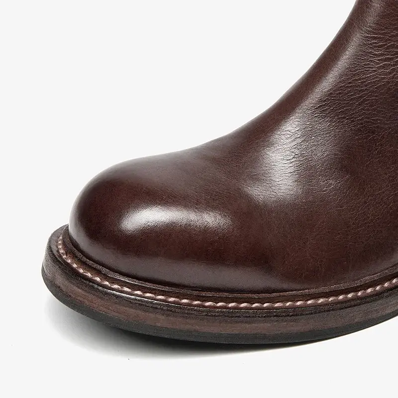 Miniatura: Four views of tall brown leather boots with a side zipper and textured rubber sole on a white background.