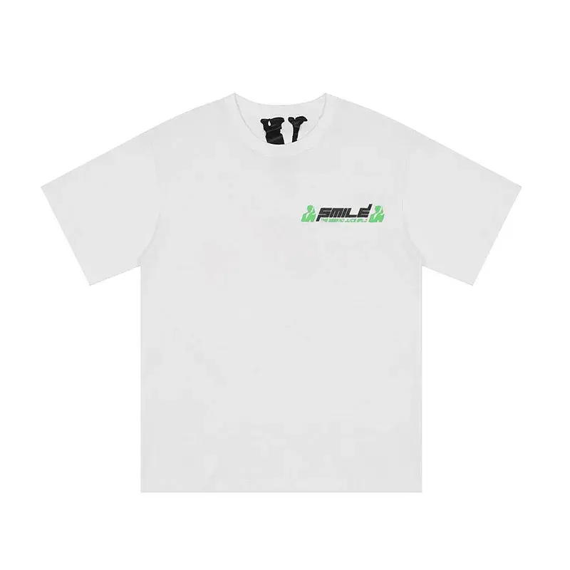 White t-shirt with a small black and green graphic logo on the left chest.