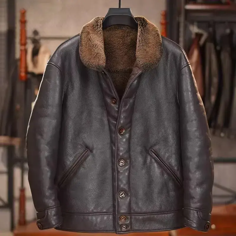 Thumbnail: Dark brown leather jacket with a plush brown collar, buttoned front, and two angled pockets, hanging in a store.