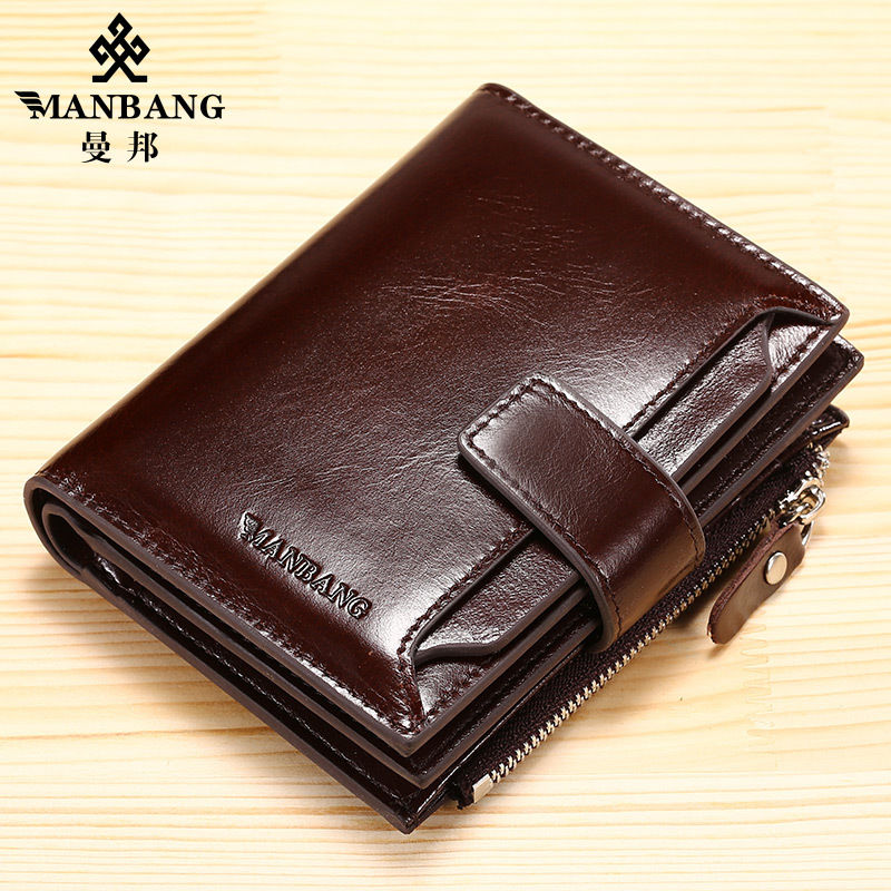 Dark brown leather wallet with a snap closure, embossed logo, and a zippered pocket on a light wooden surface.