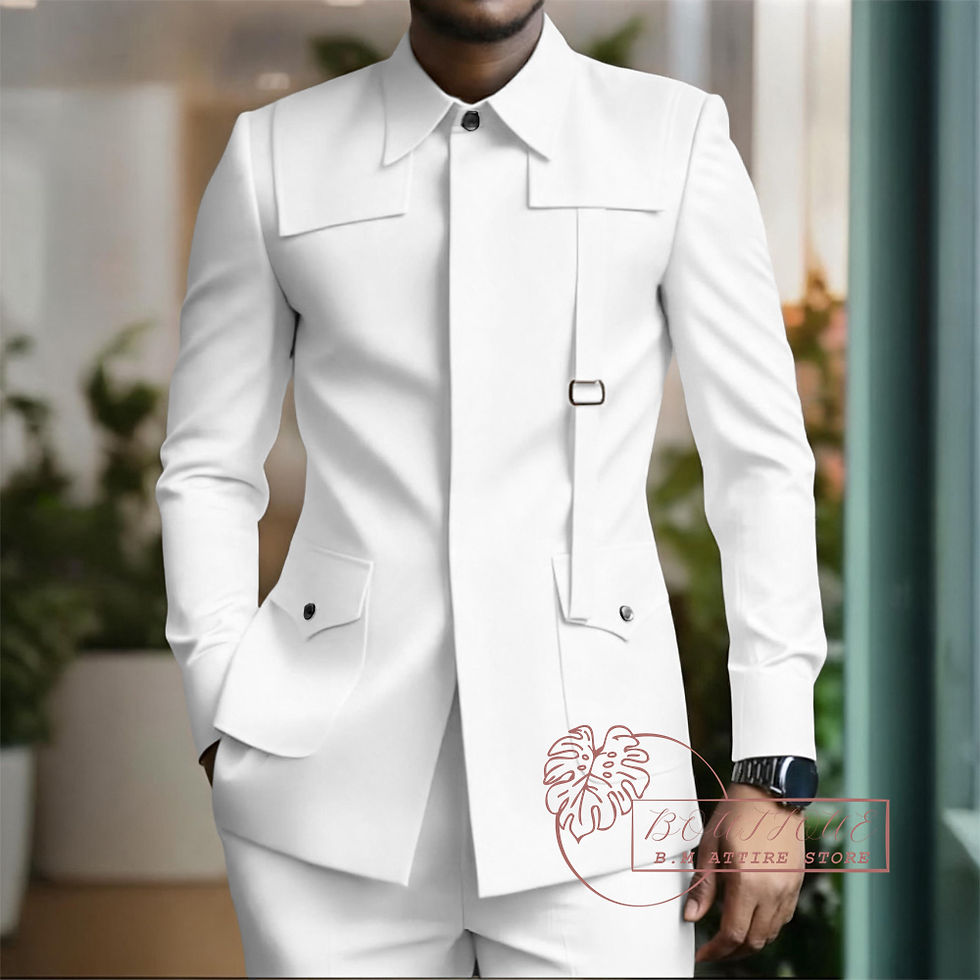 Miniatura: Man in tailored white suit with buttoned pockets, standing indoors. Background has blurred plants and a window.