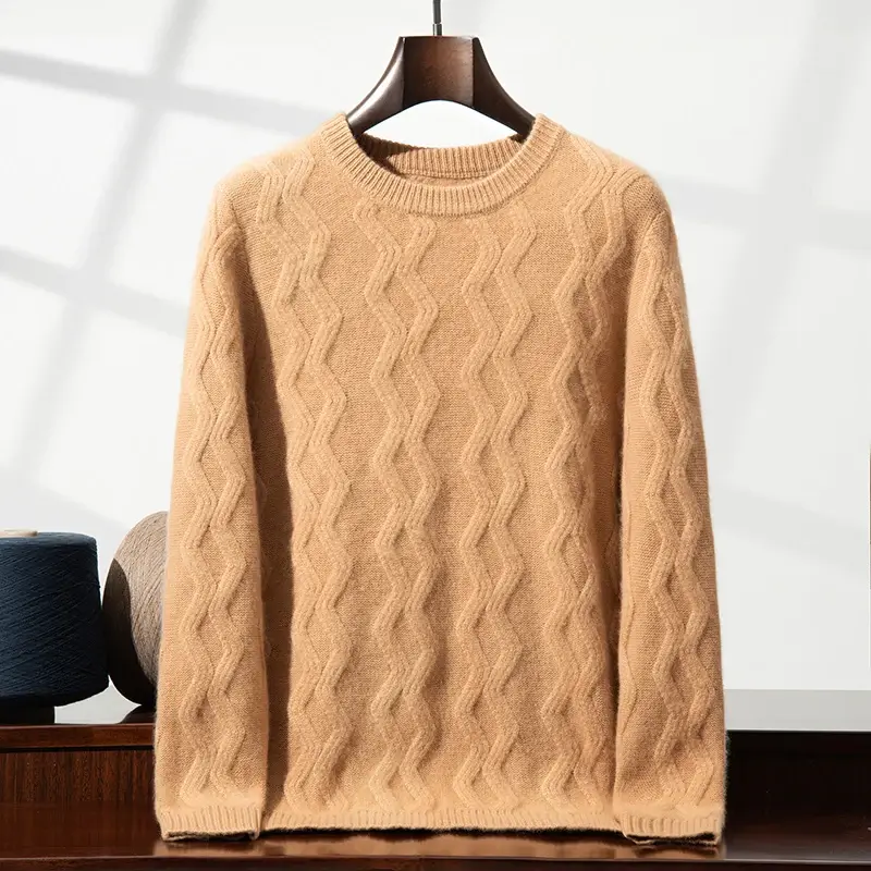 Beige sweater with a wavy cable knit pattern, displayed on a wooden hanger against a light background.