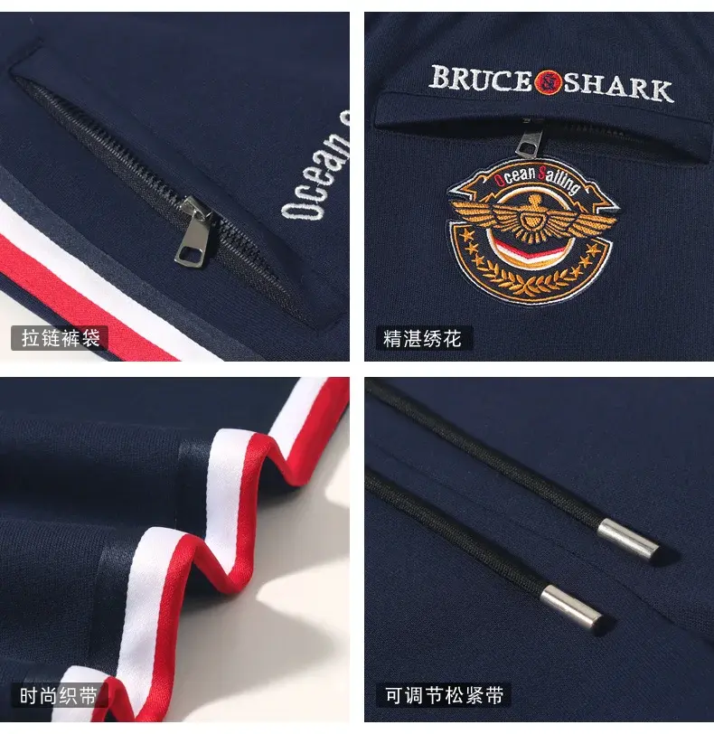 Miniatura: Navy blue fabric with red and white trim, zip pocket, embroidered badge, logo text, and drawstrings with metal tips.