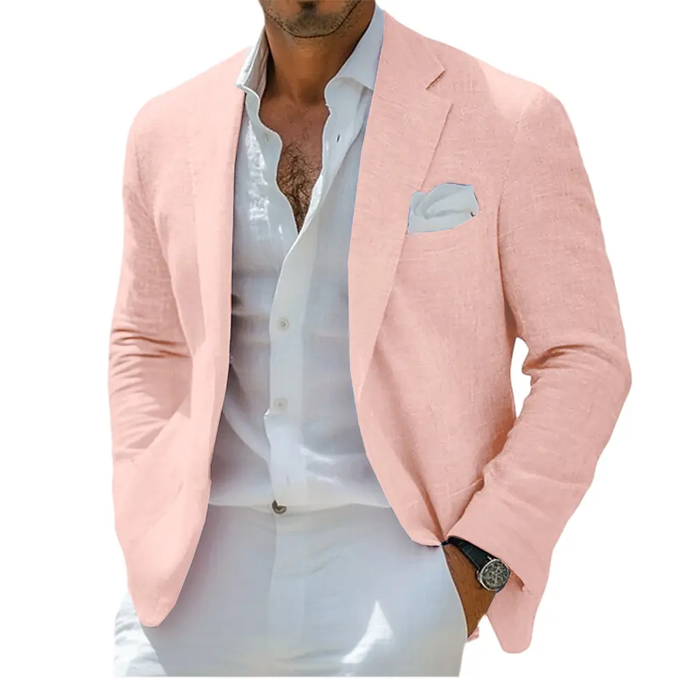 Thumbnail: Man in a tan suit jacket with a white shirt and pants, wearing a watch, standing outdoors with greenery in the background.
