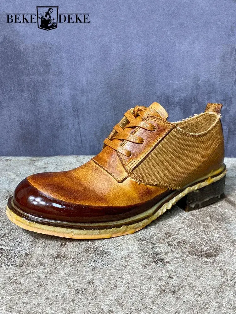 Brown leather shoe with tan fabric sides, chunky sole, and lace-up design on a textured gray surface.