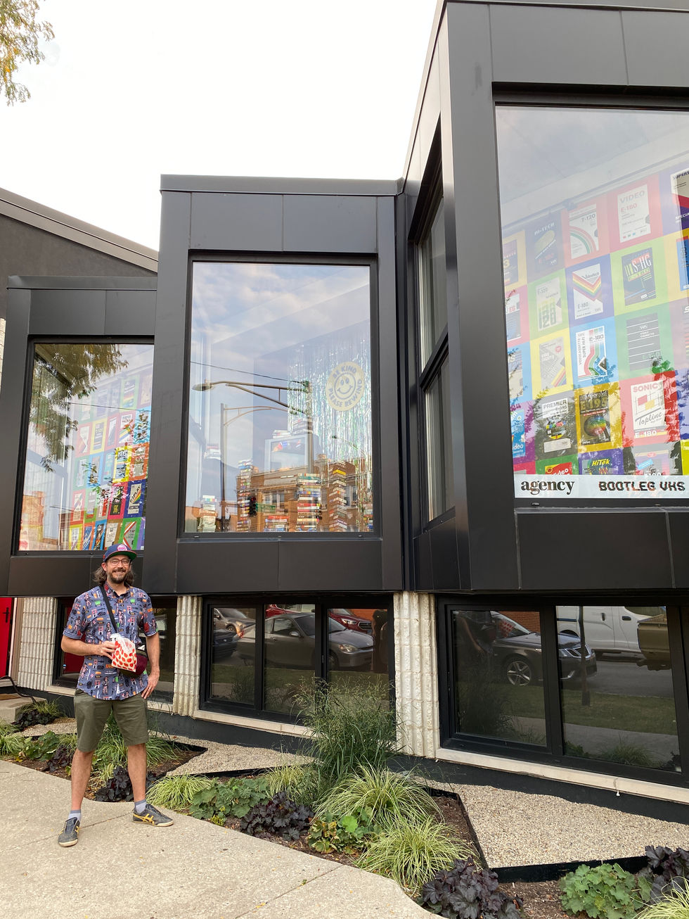 Jarrod Ryhal, founder of Bootleg VHS, in front of his "Extra Super" show