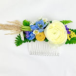 Floral hair combs adorn the top of a cascading veil or beautiful updo.