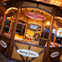 German sausages sizzling on the fire of the German Swing Grill at the Liverpool Christmas Market