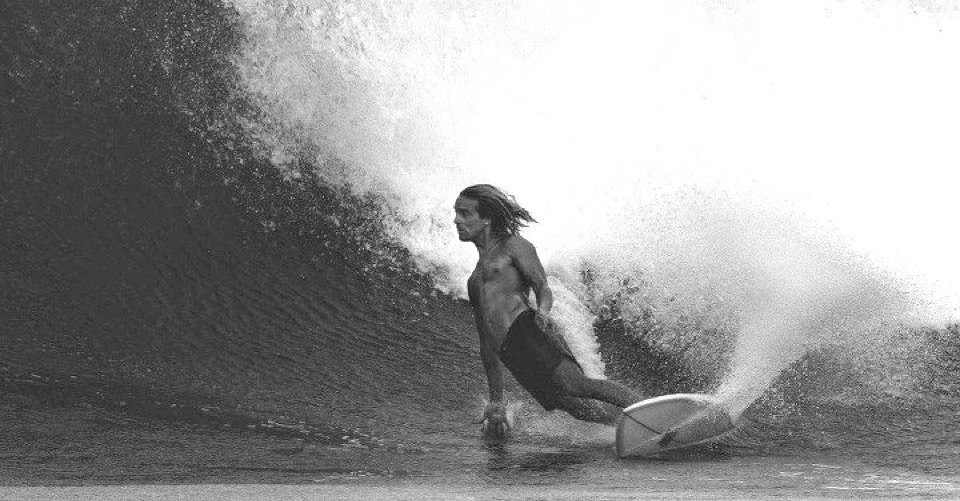 Surfer riding wave - home page image on Ink & Foam website